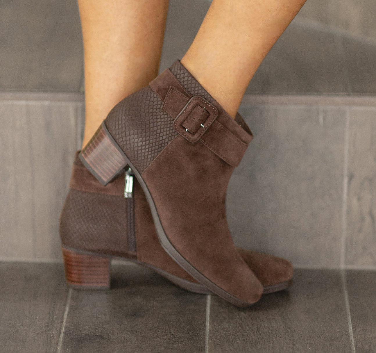 MUNRO ESPRESSO COLOR SUEDE CALLIE BOOTIE AND PRINTED SUEDE ON BACK OF BOOT WITH DECORATE STRAP AND COVERED BUCKLE ON SHAFT WITH MODEL STANDING OF STAIR STEP-LIFESTYLE