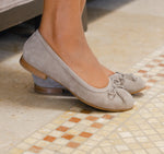 Joslynn kid suede in deep taupe flatt with a dainty bow and half-inch wedge for comfort - on feet