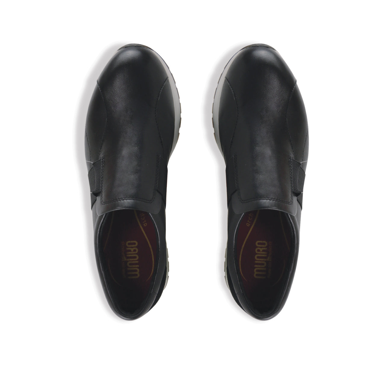 Laurel slip-on athleisure in black kid leather and black suede trim and color matched wide band gore on vamp with white outsole-top view