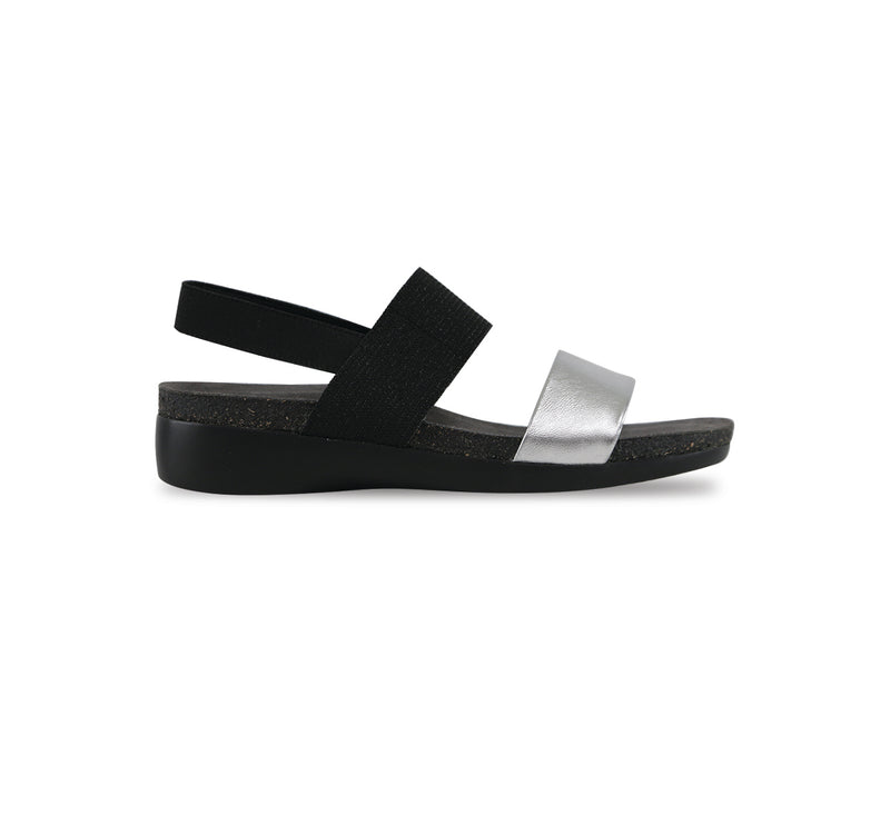 Pisces double-strap footbed sandal with black stretch fabric instep and ankle strap and silver color suede vamp strap-side view