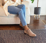 MUNRO NEKO ANKLE BOOTIE IN ALMOND COLOR SUEDE ZIPPERS ON INSIDE AND OUTSIDE  ON MODEL IN BLUE JEANS-LIFESTYLE