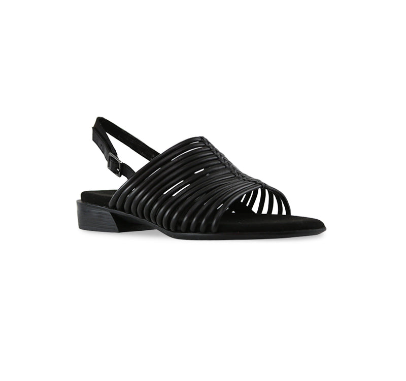 Celia low-heel black leather backstrap strappy sandal with tubular leather vamp straps and buckle on ankle strap-angle view