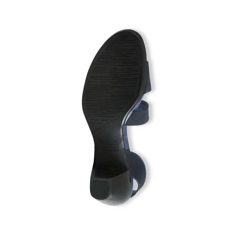 Lucia dress sandal with a single-band vamp strap and an asymmetrical hook & loop instep strap in navy leather-bottom view