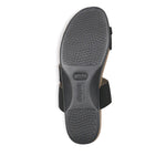 Aries toe-ring footbed slide sandal with asymmetrical vamp strap and wide band instep strap in black stretch fabric-bottom view