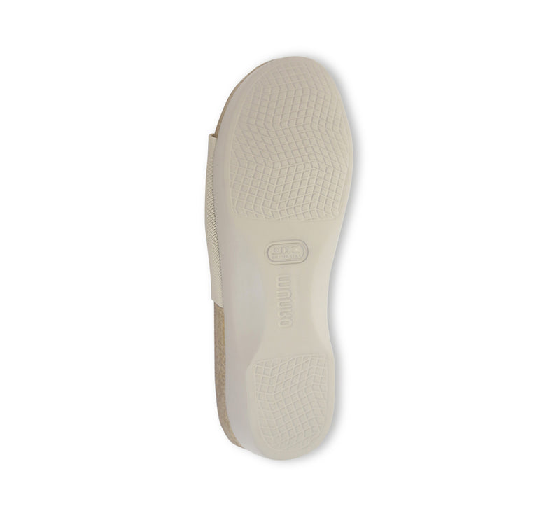 Casita single strap footbed slide sandal on low-wedge outsole in bone stretch fabric-bottom view