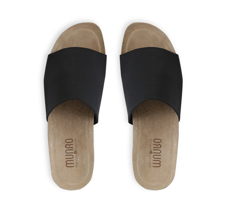 Casita single strap footbed slide sandal on low-wedge outsole in black stretch fabric-top view