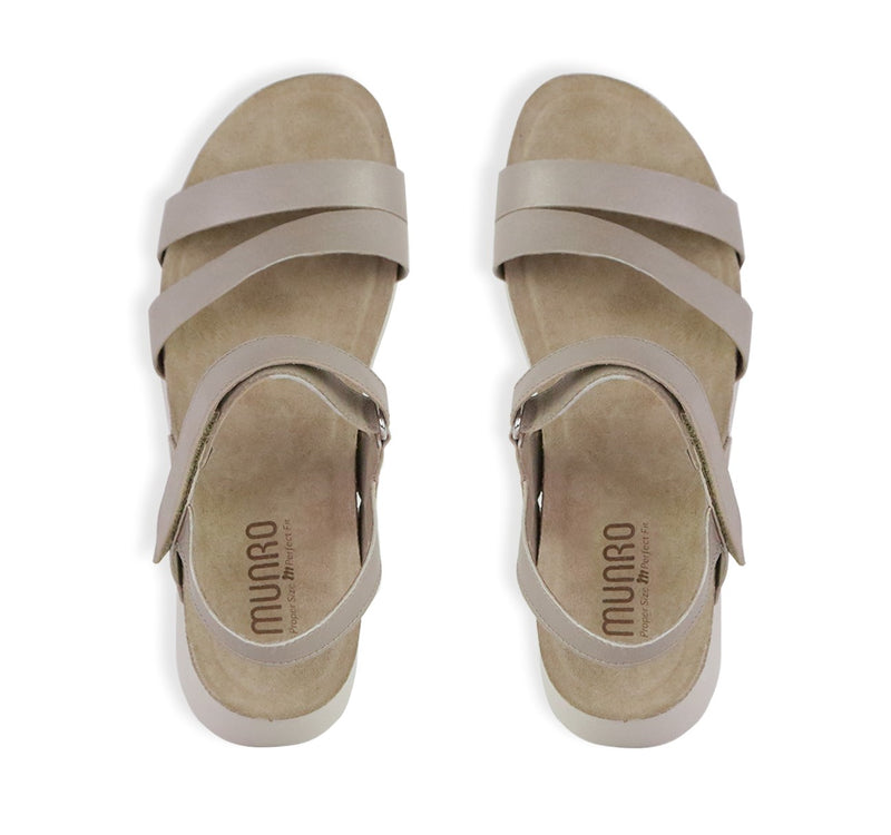 Juniper strappy suede covered cork footbed sandal on platform wedge in taupe metallic leather-top view